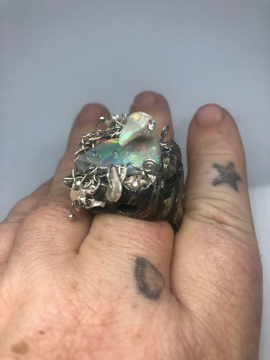 Opal Carved Bird taking a bath
