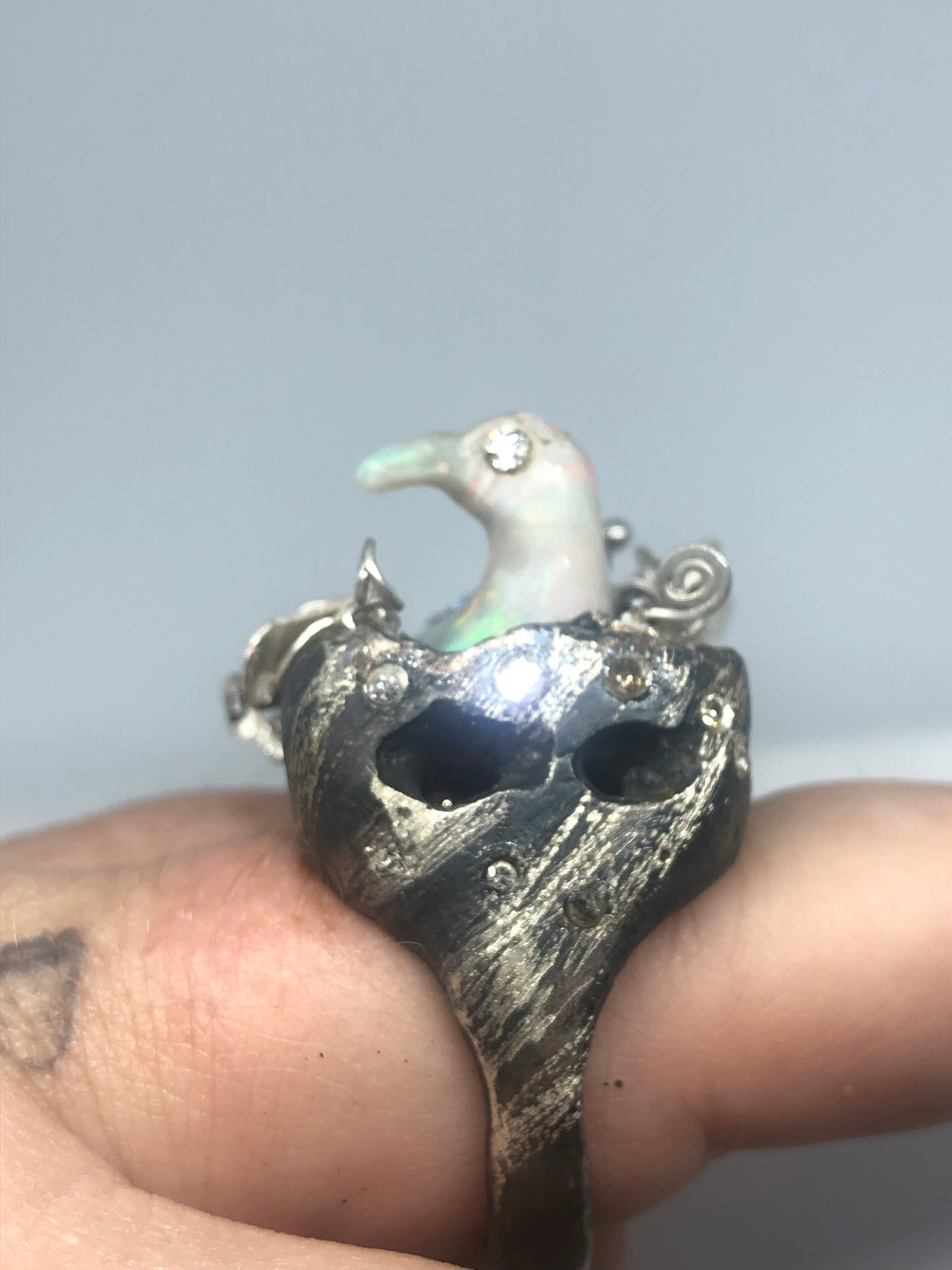 Opal Carved Bird taking a bath