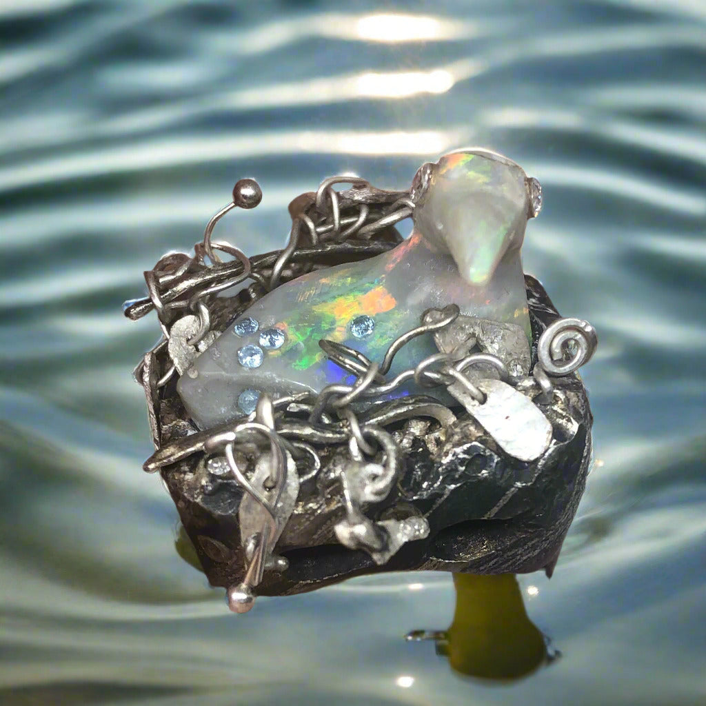 Opal Carved Bird taking a bath