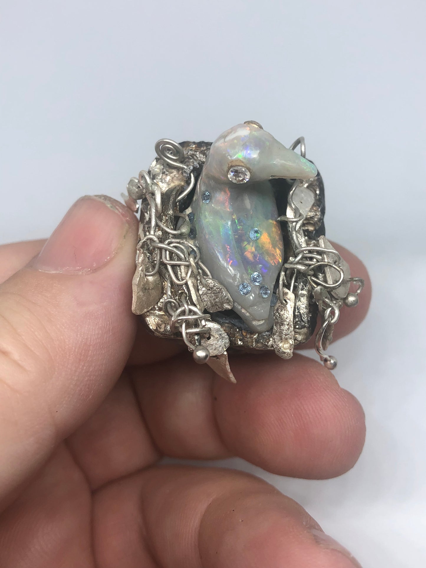 Opal Carved Bird taking a bath