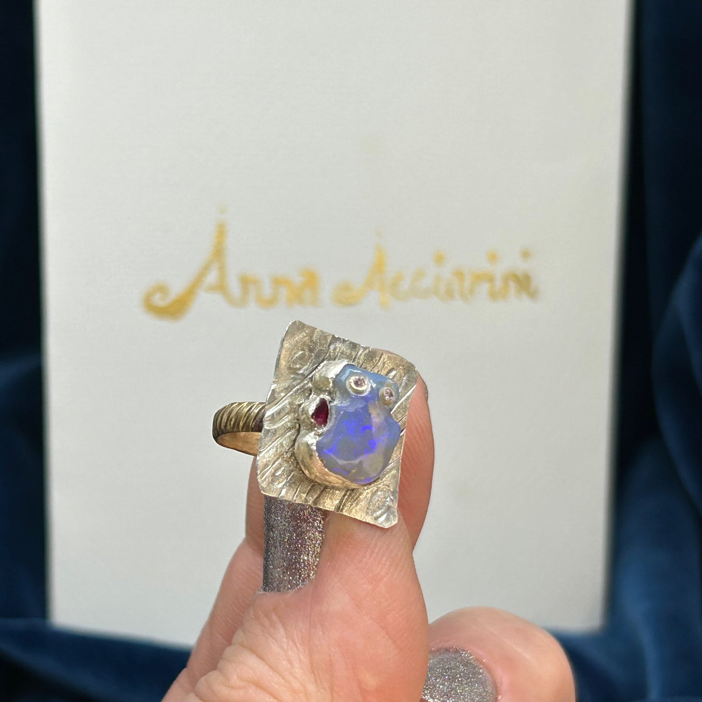 "Little Red hand Man" Carved opal, diamonds silver gold