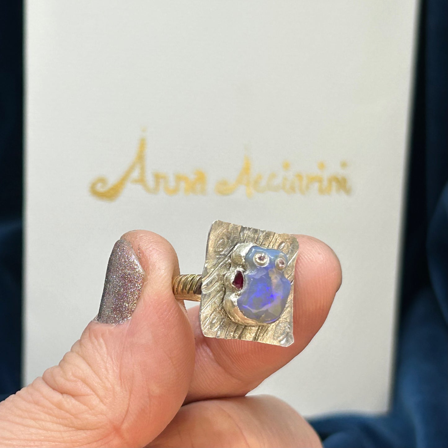 "Little Red hand Man" Carved opal, diamonds silver gold